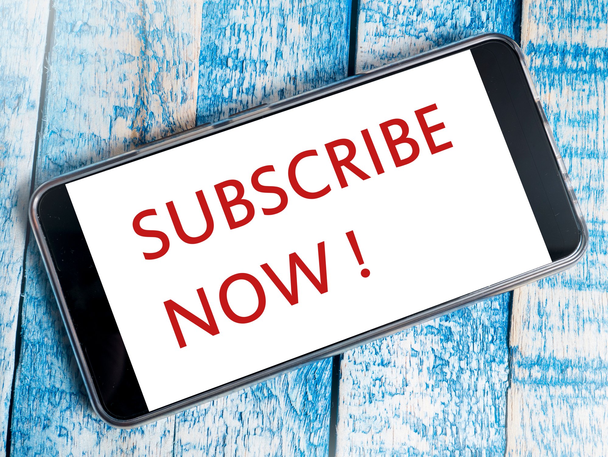 Smartphone with the words Subscribe Now on it.