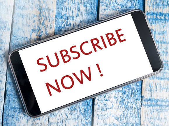 Smartphone with the words Subscribe Now on it.