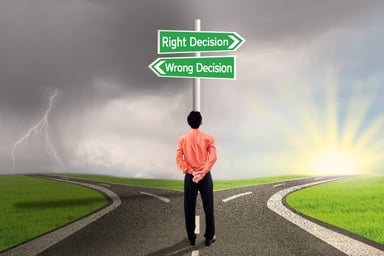 Man with right and wrong decision signs