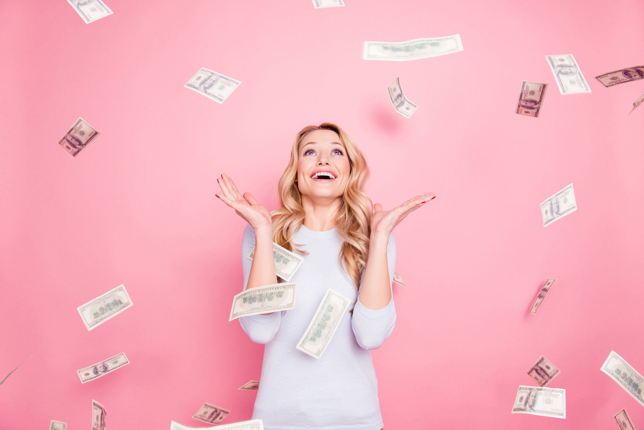 woman surrounded by money