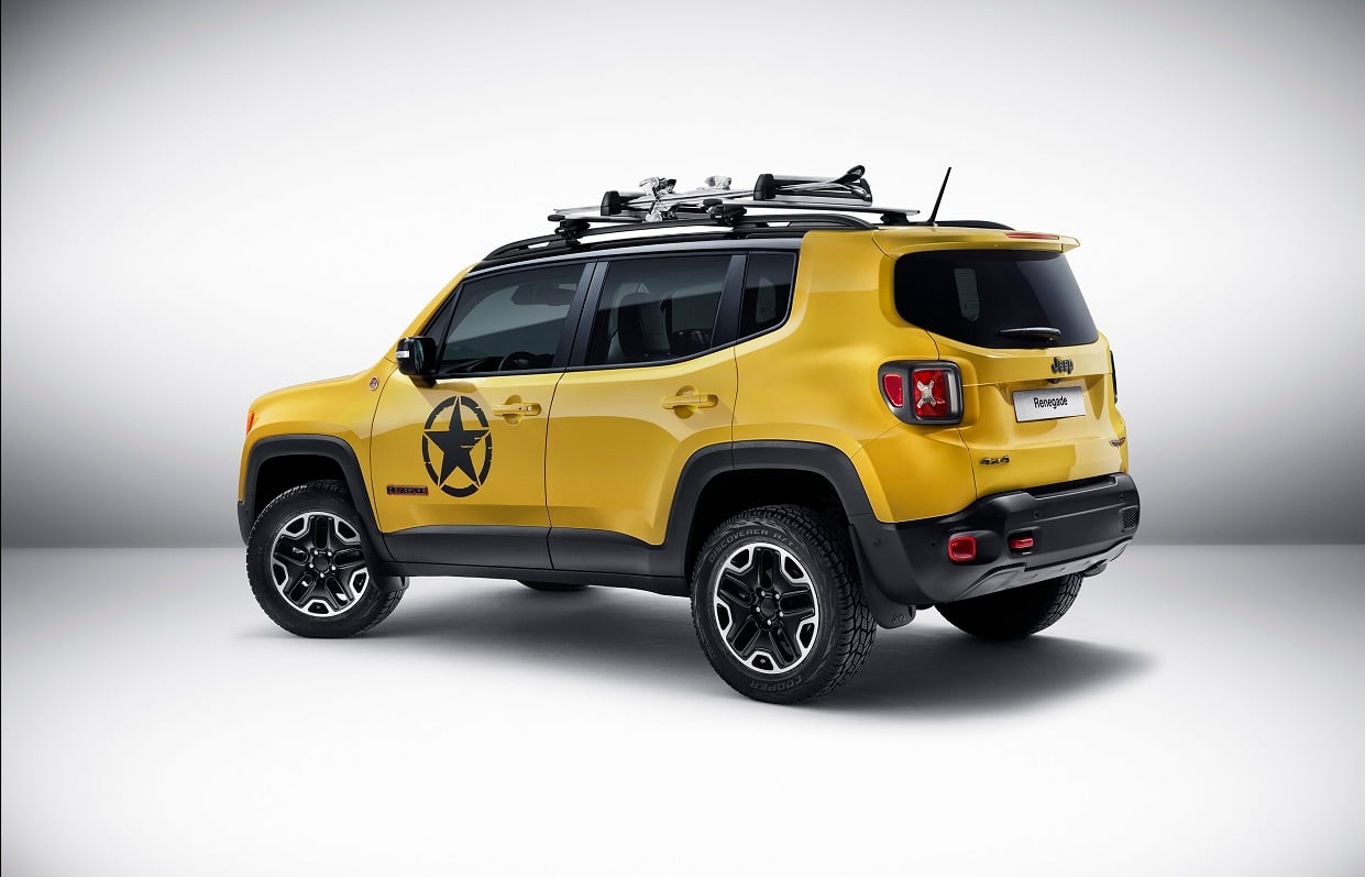 Yellow Jeep with star on the side, in a white room.