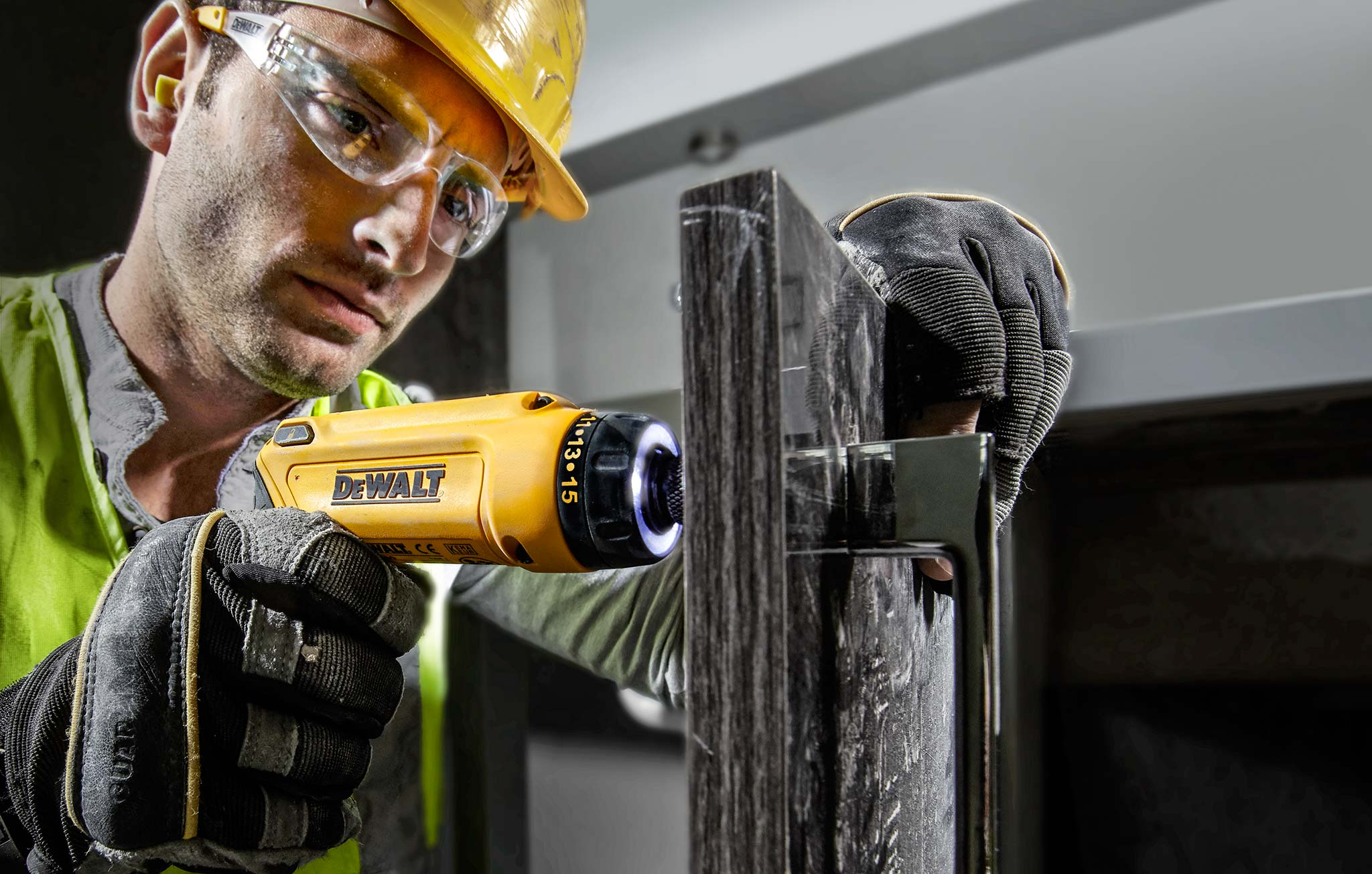 A man operating a power tool.