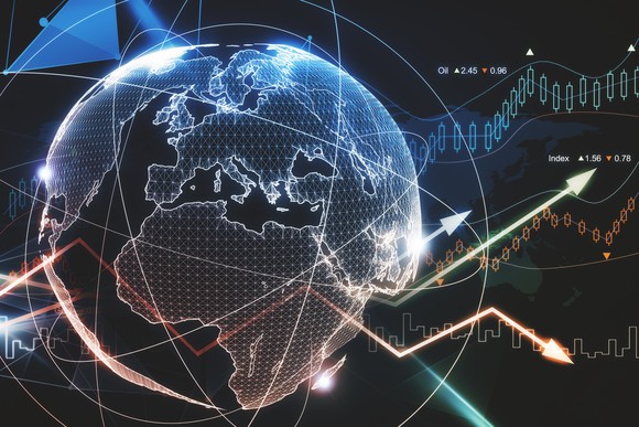 Globe with stock market charts overlaid. 