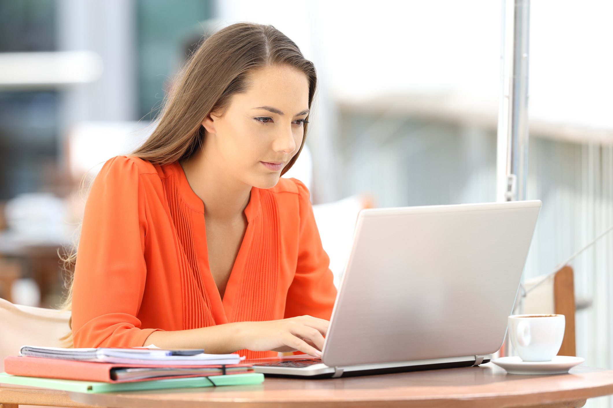 Woman working on a notebook computer.