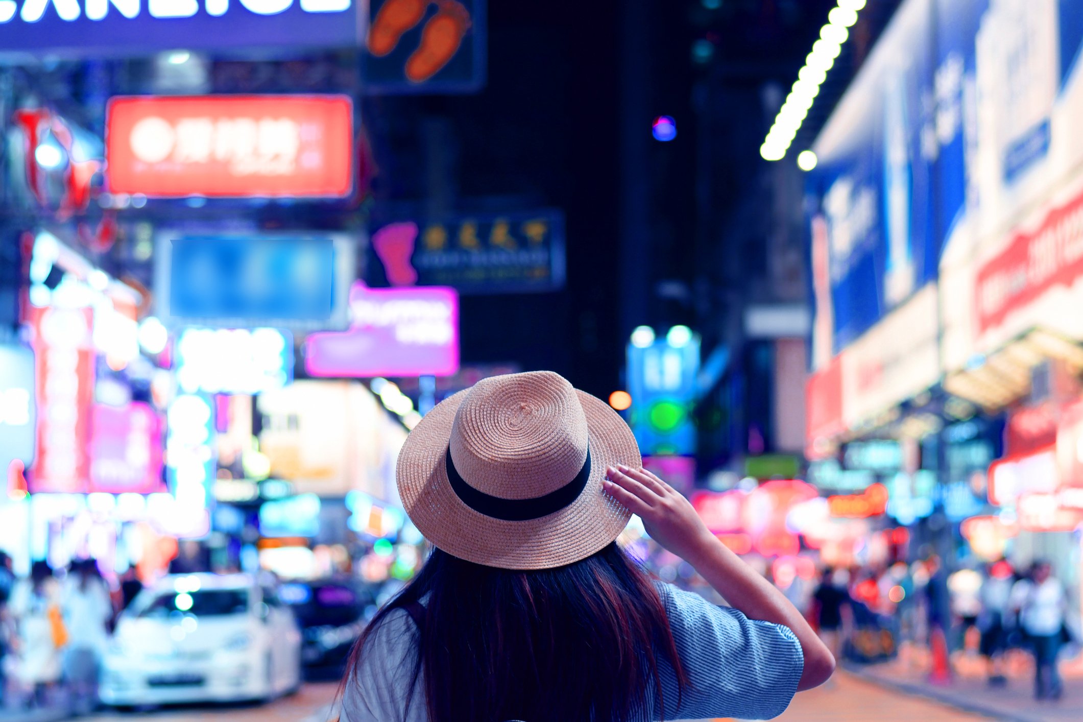 A tourist visits a night market in Hong Kong.