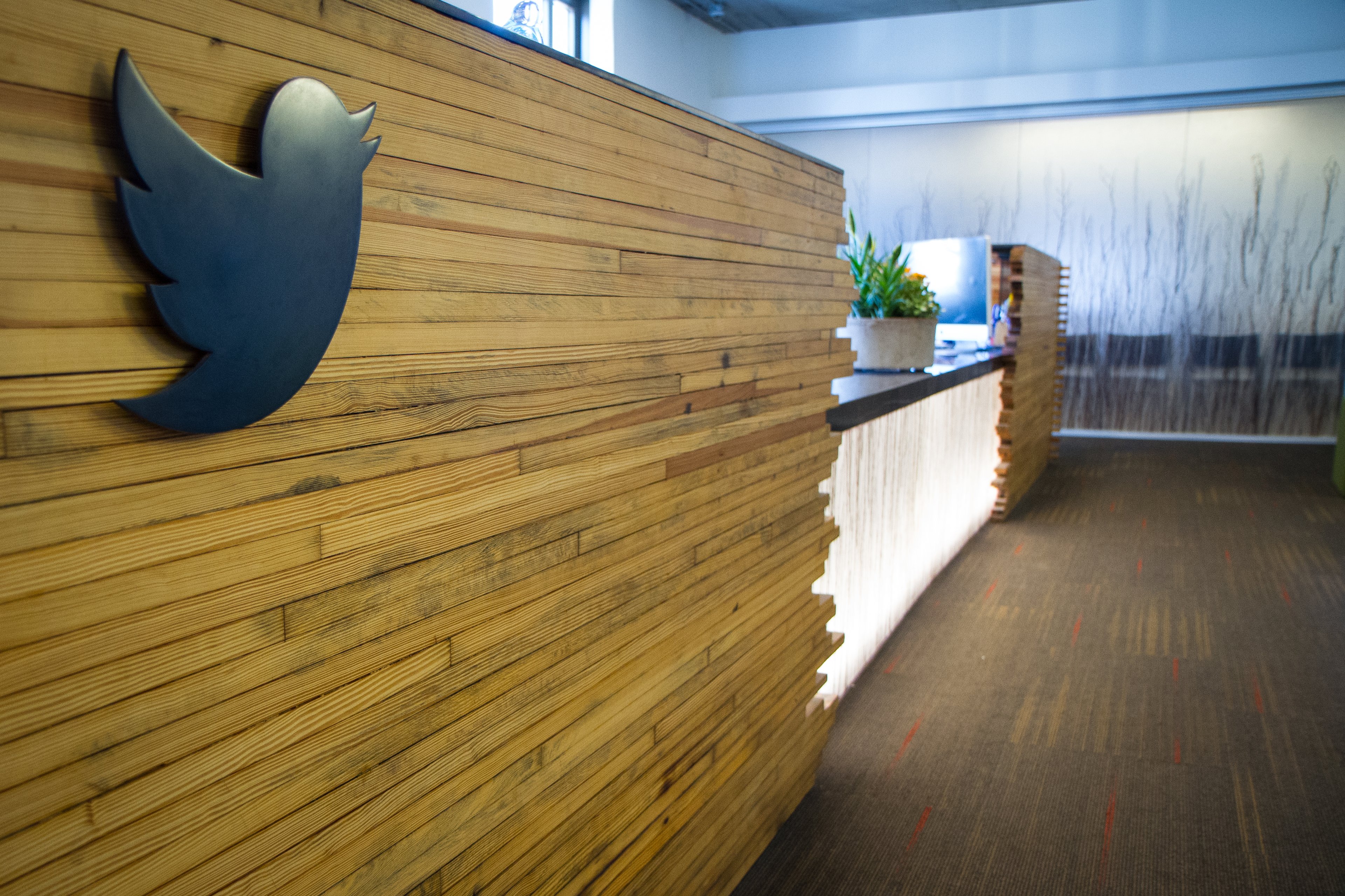 A reception desk with a Twitter bird decal.