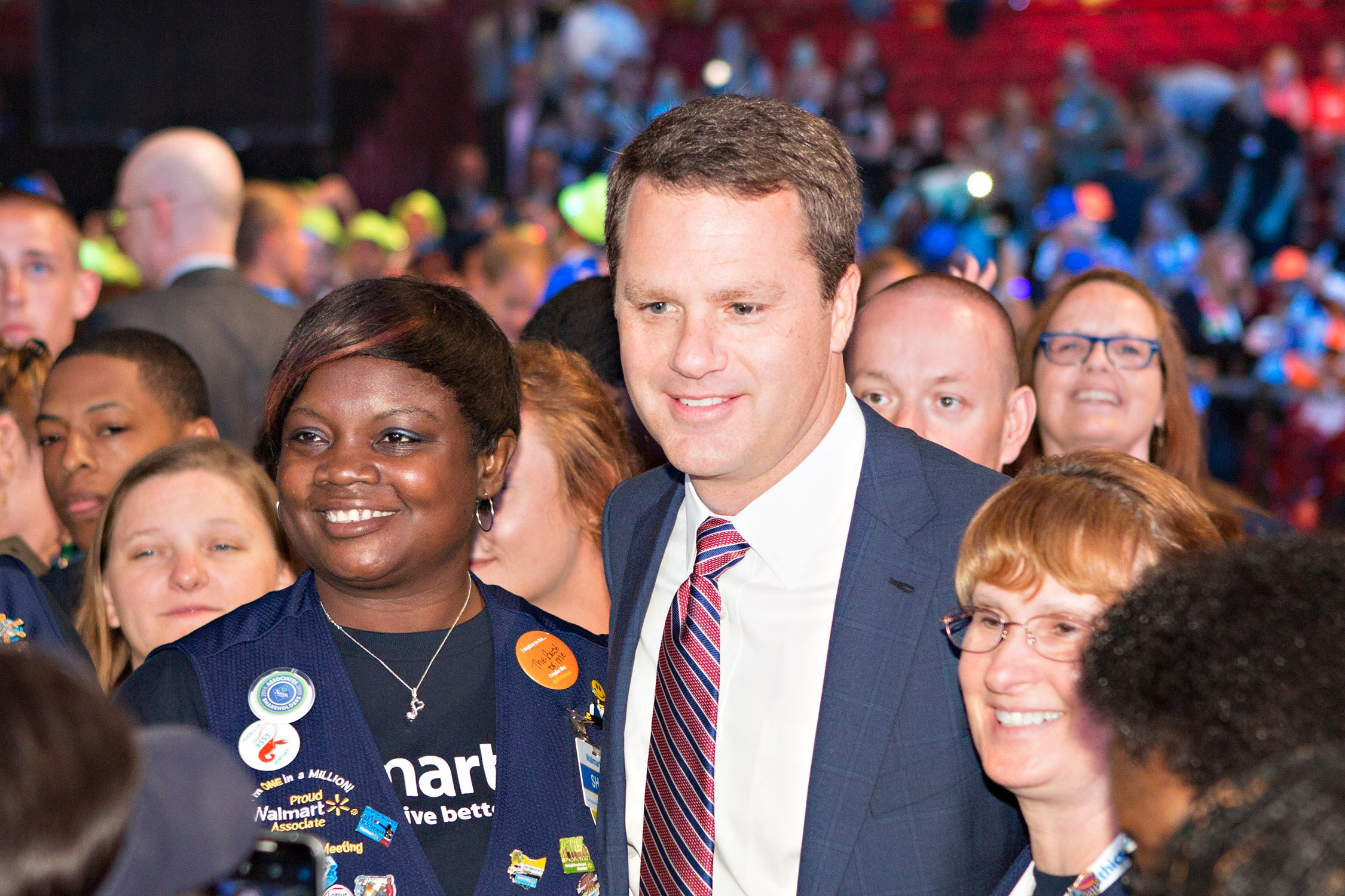 Walmart CEO Doug McMillon in a crowd of employees.