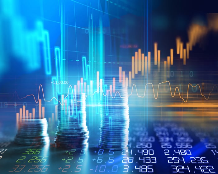 Rising graphs, stcks of coins, and columns of numbers.