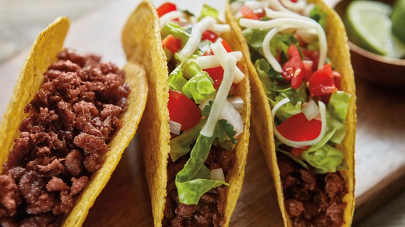 Three ground beef tacos made with Beyond Beef.
