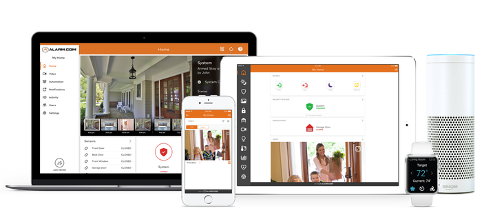 Computer, notebook, and cell phone screens showing images of homes being monitored.