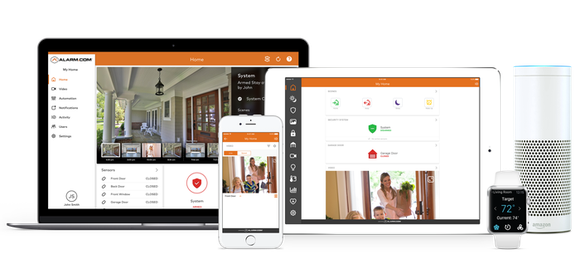 Computer, notebook, and cell phone screens showing images of homes being monitored.