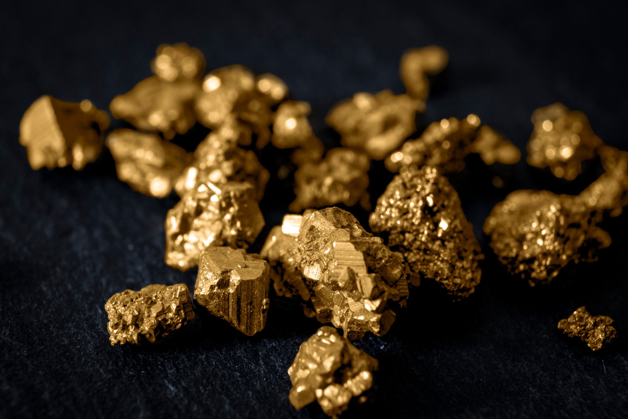 Gold nuggets with a black background.
