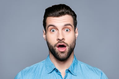 Surprised man with raised eyebrows