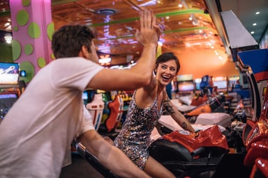 couple playing arcade game