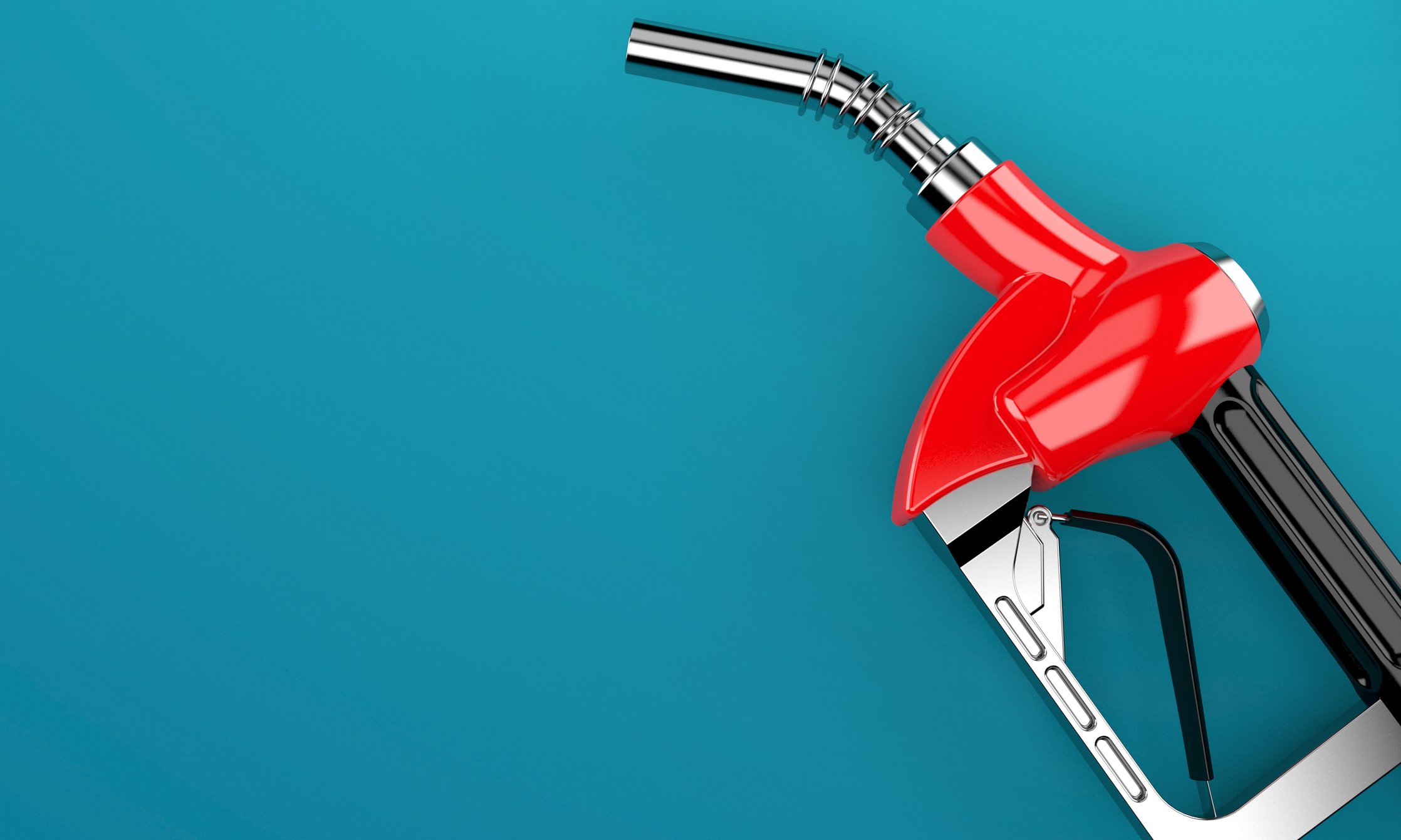 A red fuel pump handle on a blue background.