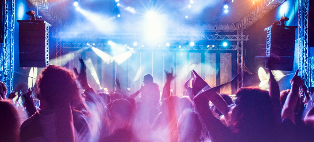 An audience watching a performance on a stage
