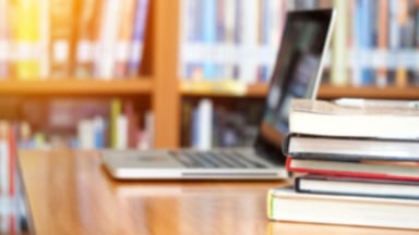 Books and Laptop on Library Table