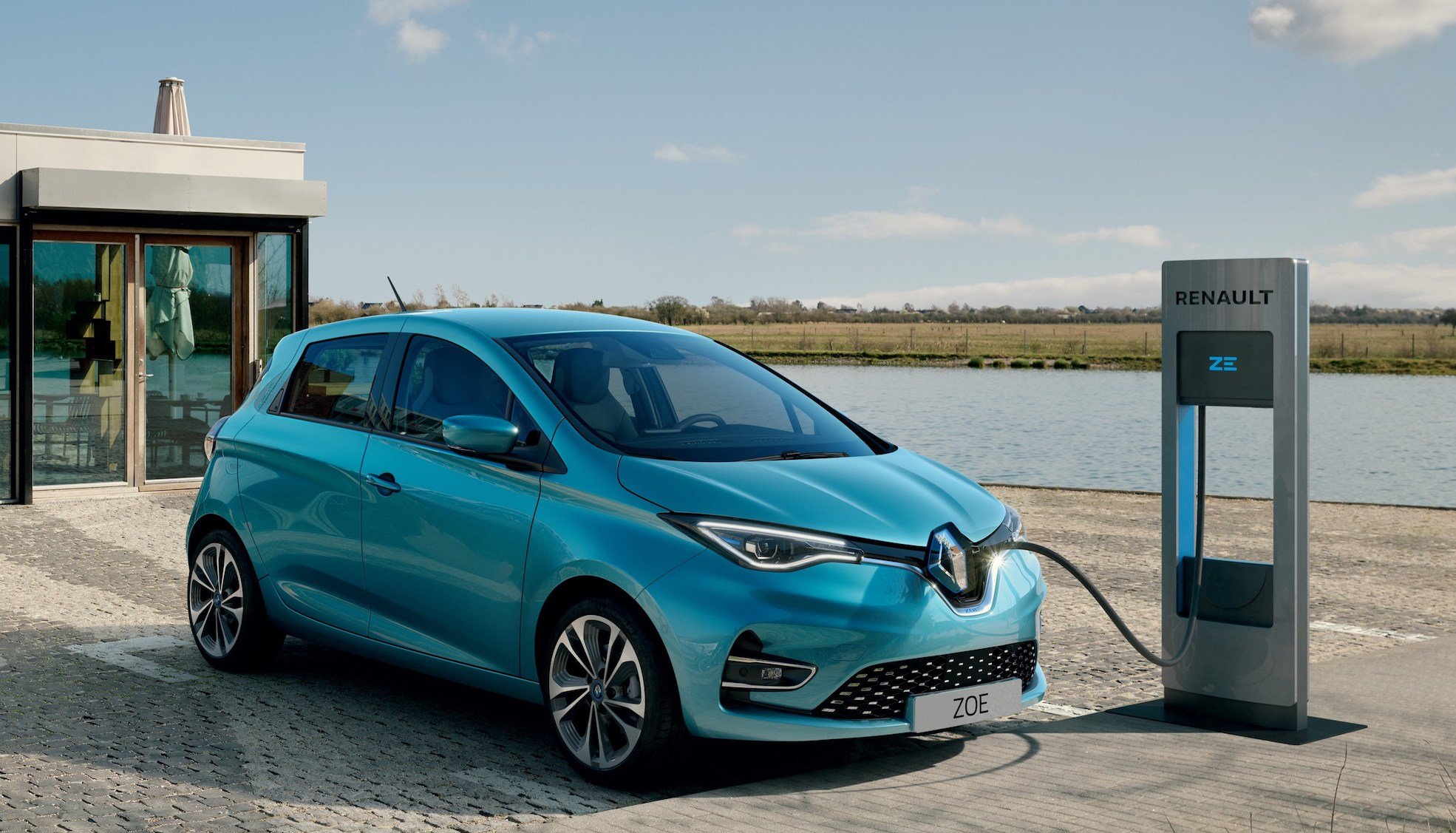 A blue 2019 Renault Zoe, an electric hatchback, is shown at a recharging station. 