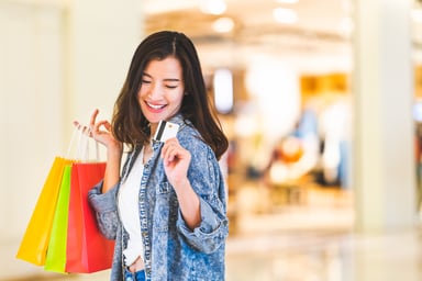 Woman with credit card while shopping