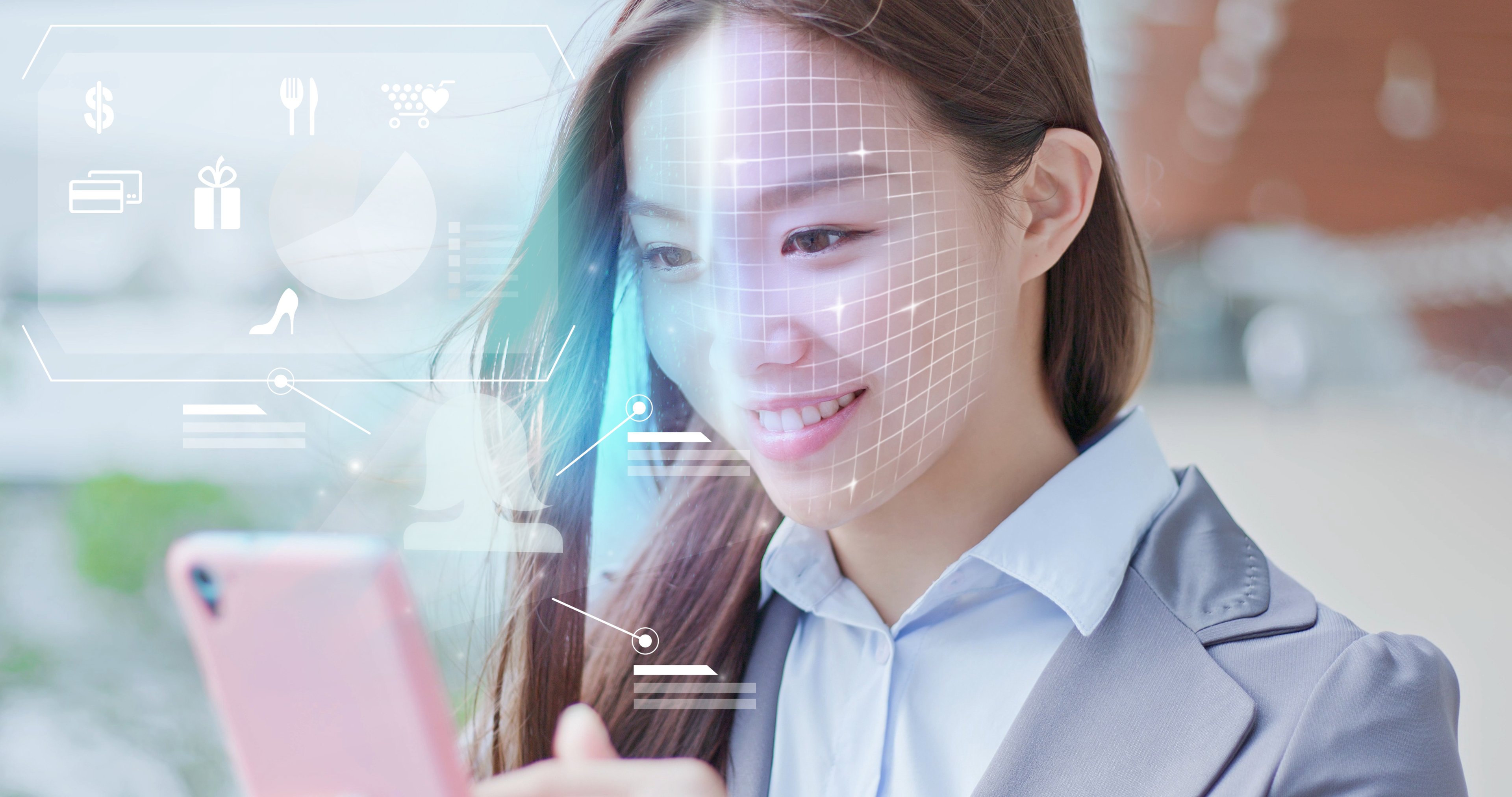 A woman uses a facial-recognition app on her smartphone.