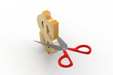 Scissors cutting dollar sign