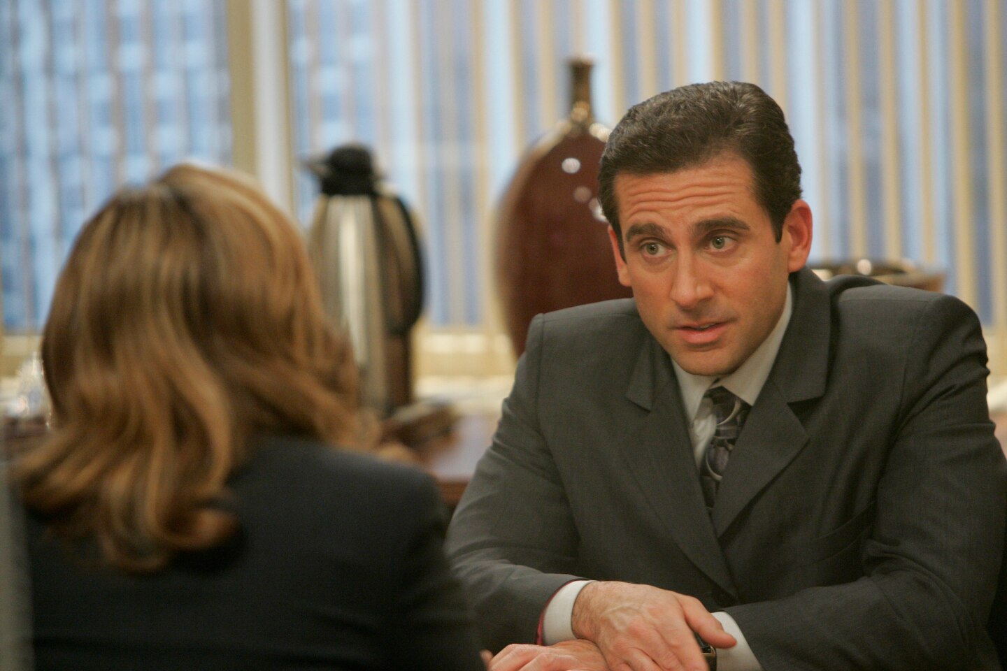 A man sitting across from a woman at a table.