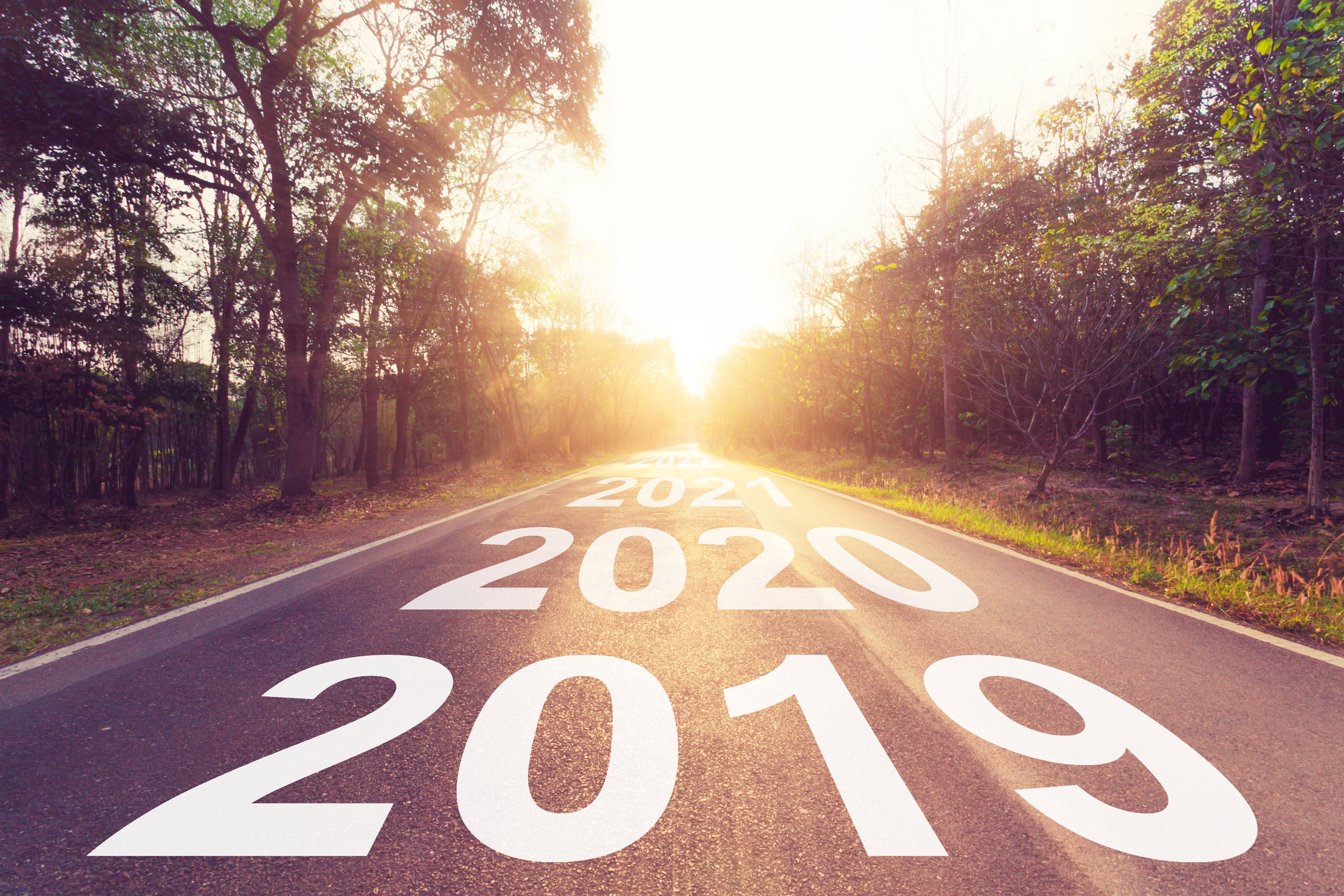2019, 2020, and 2021 overlaid on a road.
