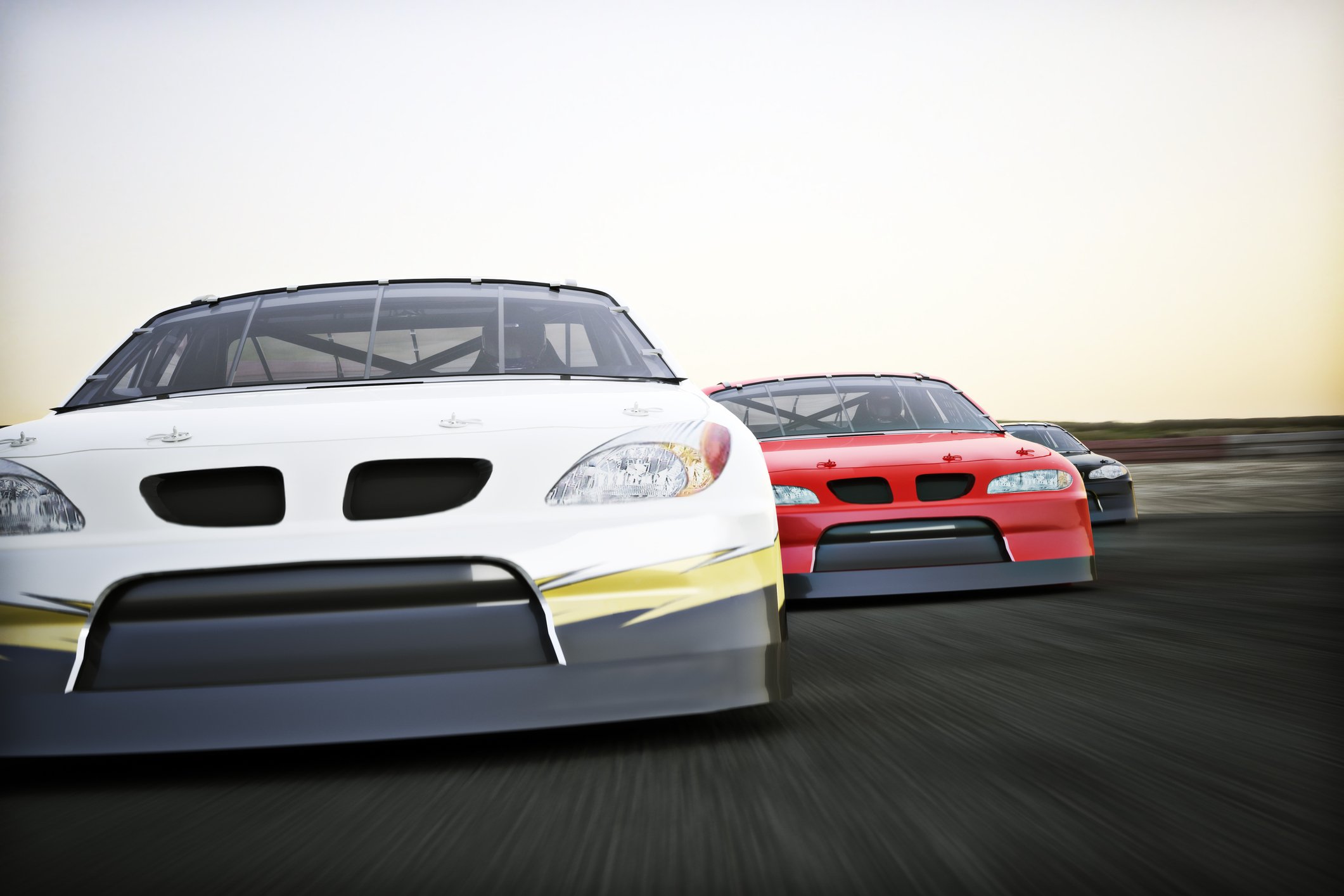 Three cars racing