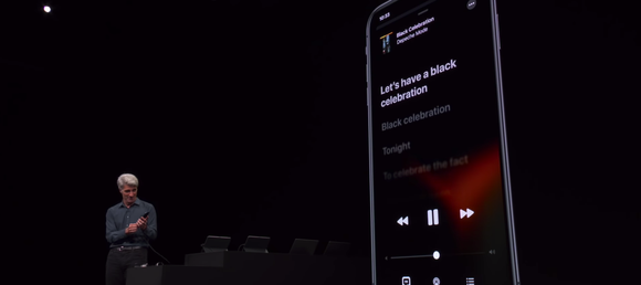 Craig Federighi on stage showing new Music app