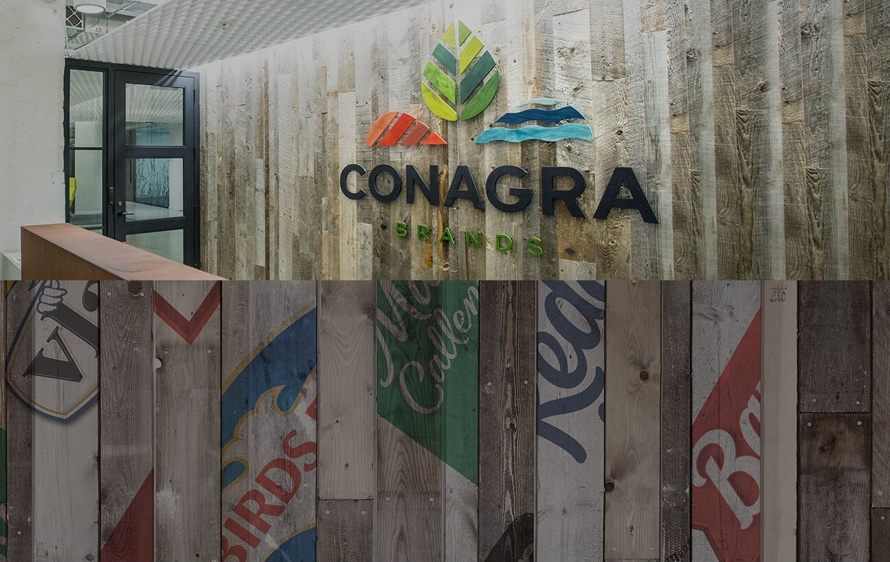 Wood paneled wall with Conagra logo, and slips of brands.
