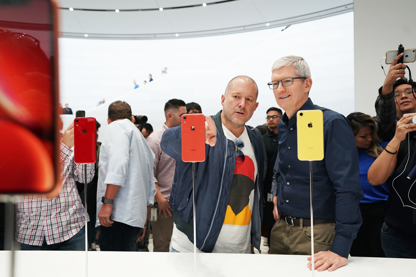 Jony Ive and Tim Cook at an Apple event in an Apple store.