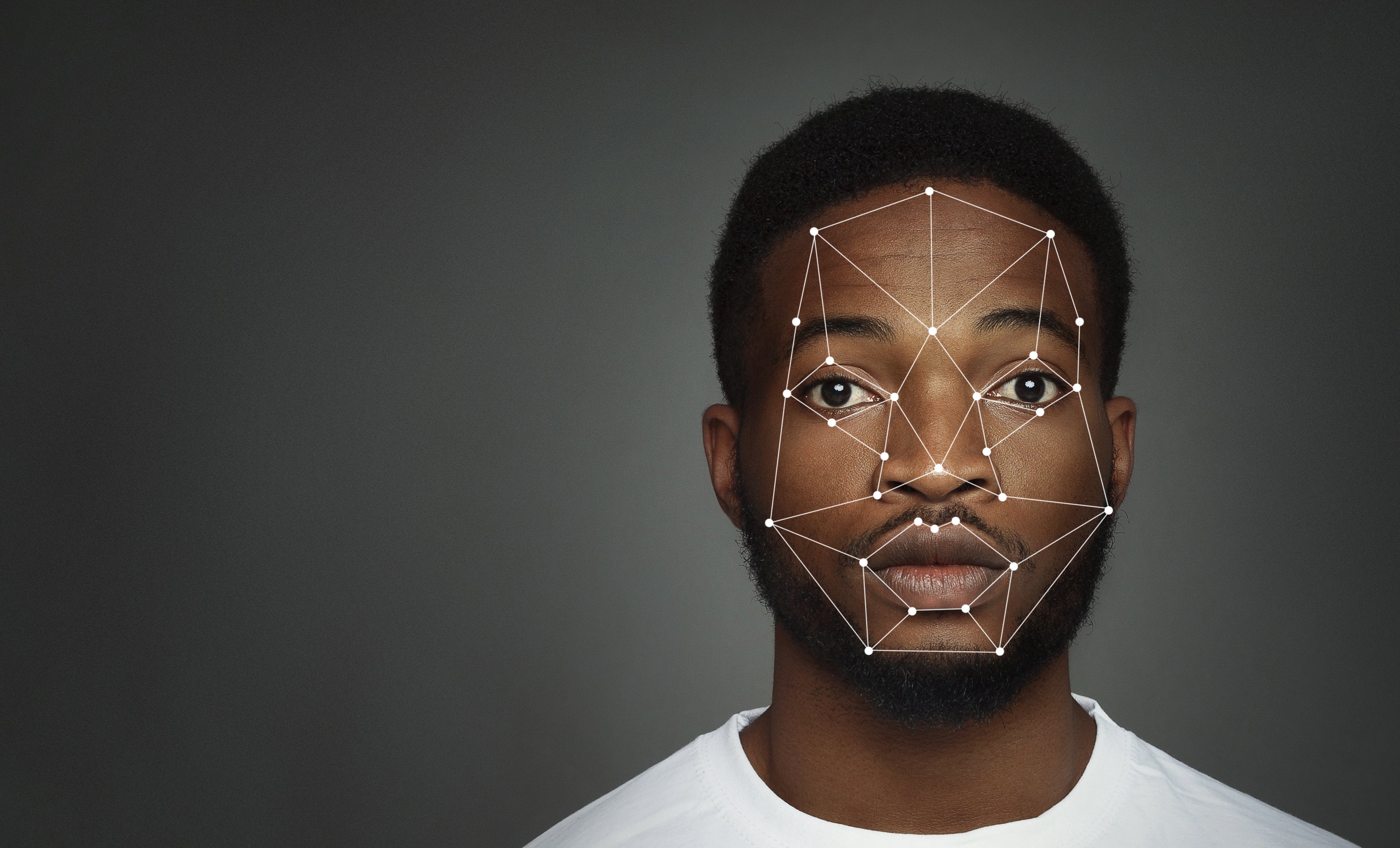 Representation of facial recognition technology on black male's face