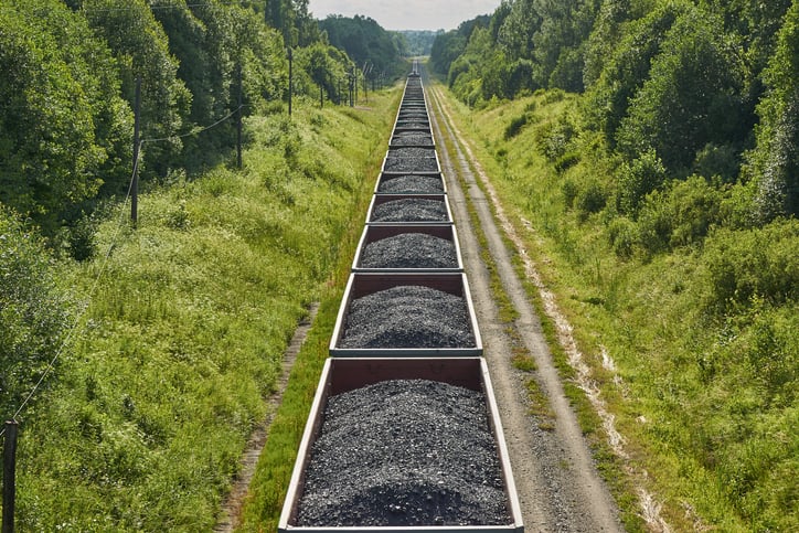 A train hauling cars full of coal.