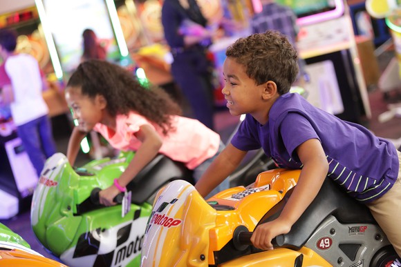 Children playing with immersive video games