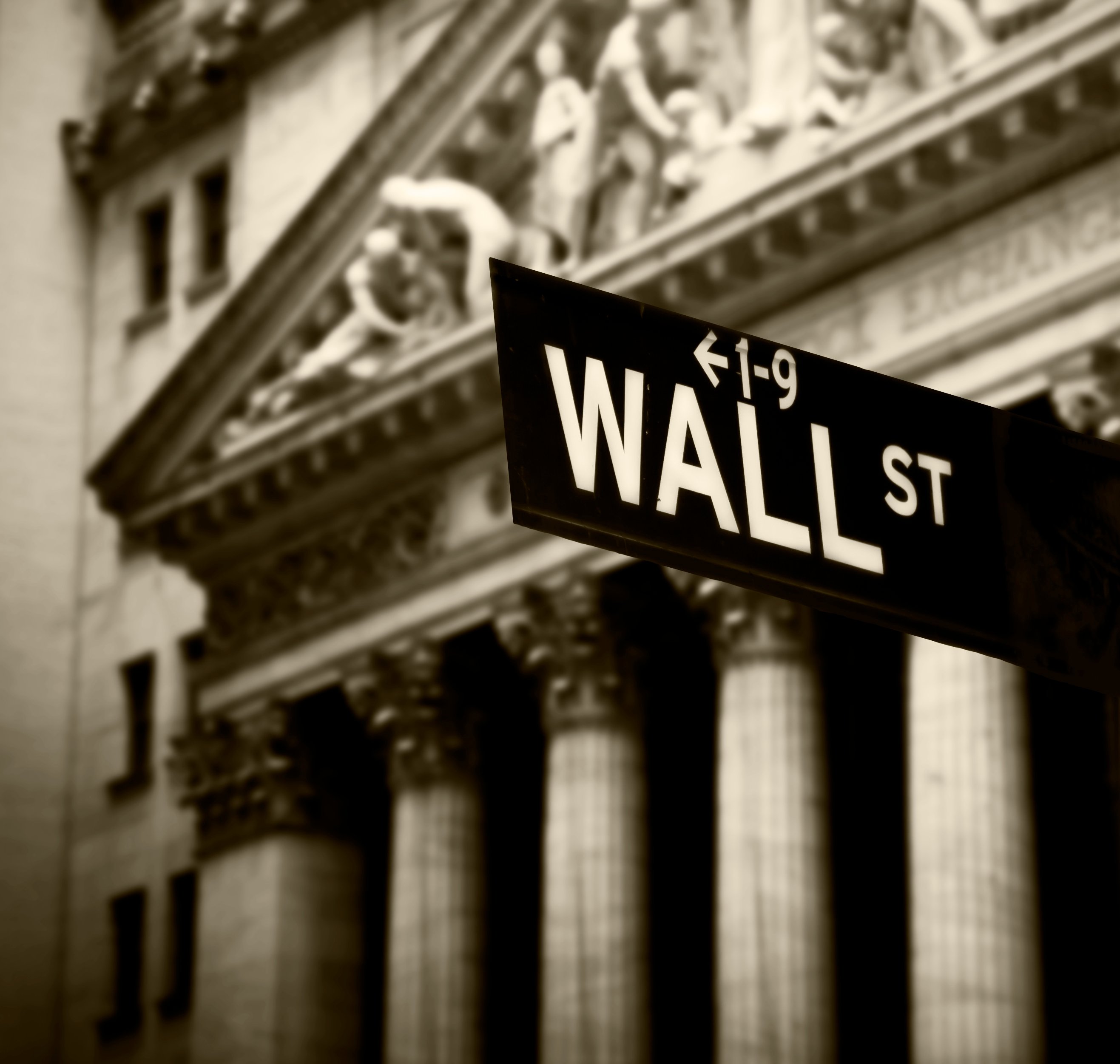 Picture of Wall Street sign in front of New York Stock Exchange.