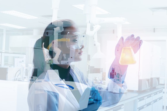 A researcher in a lab working with chemicals.