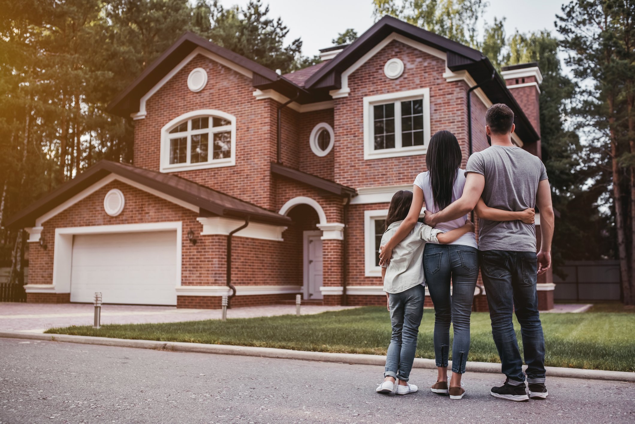a family looking at their home