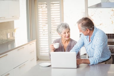 senior couple at laptop_GettyImages-674772504