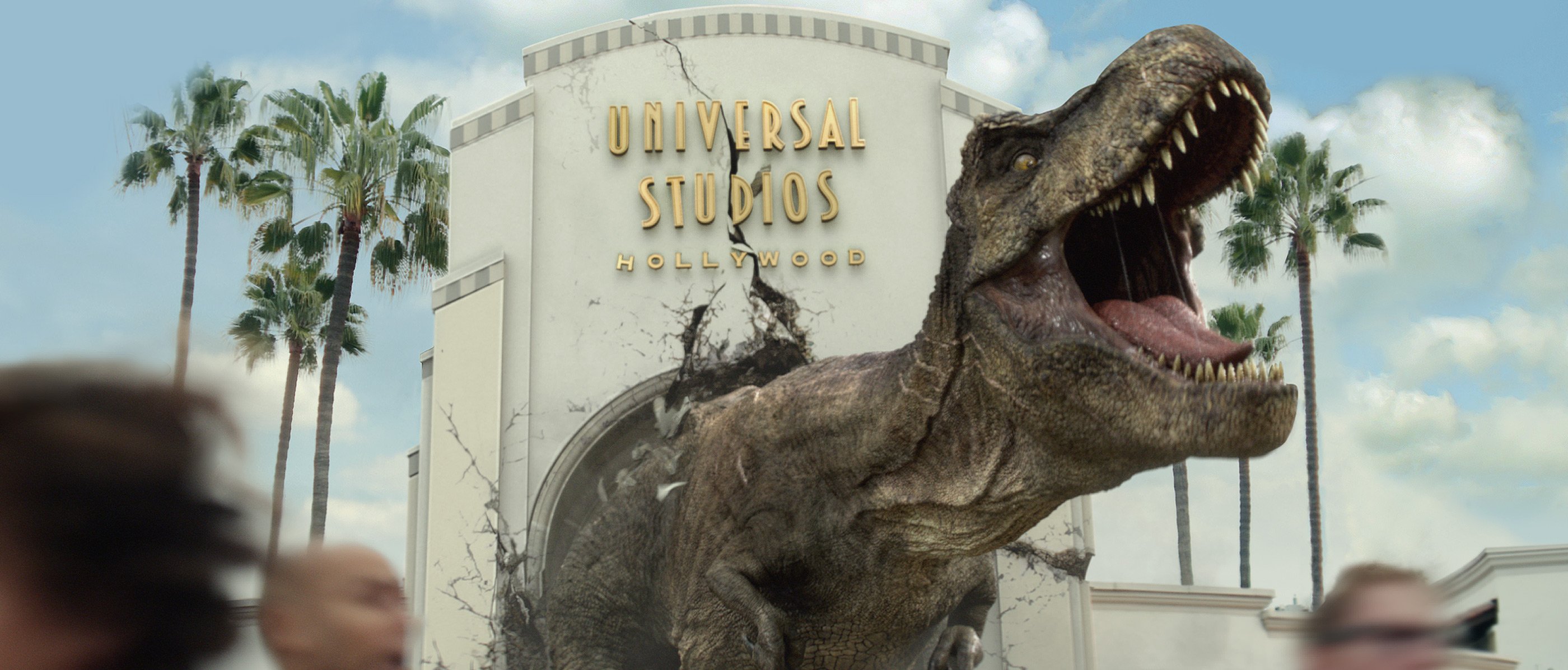 A T-Rex busting through the Universal Studios Hollywood entrance.