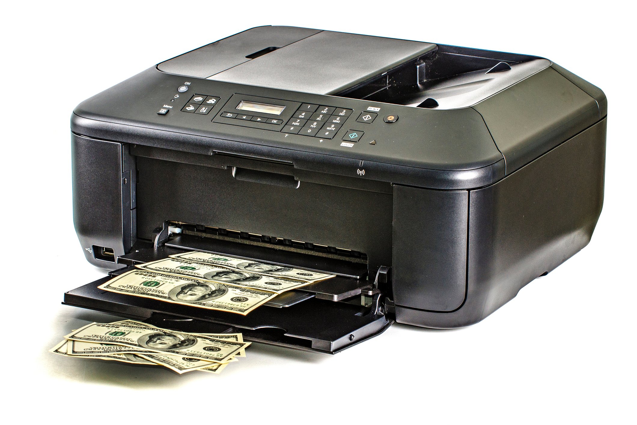 A printer spitting out sheets full of hundred-dollar bills.
