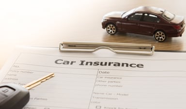 car insurance form on a clipboard