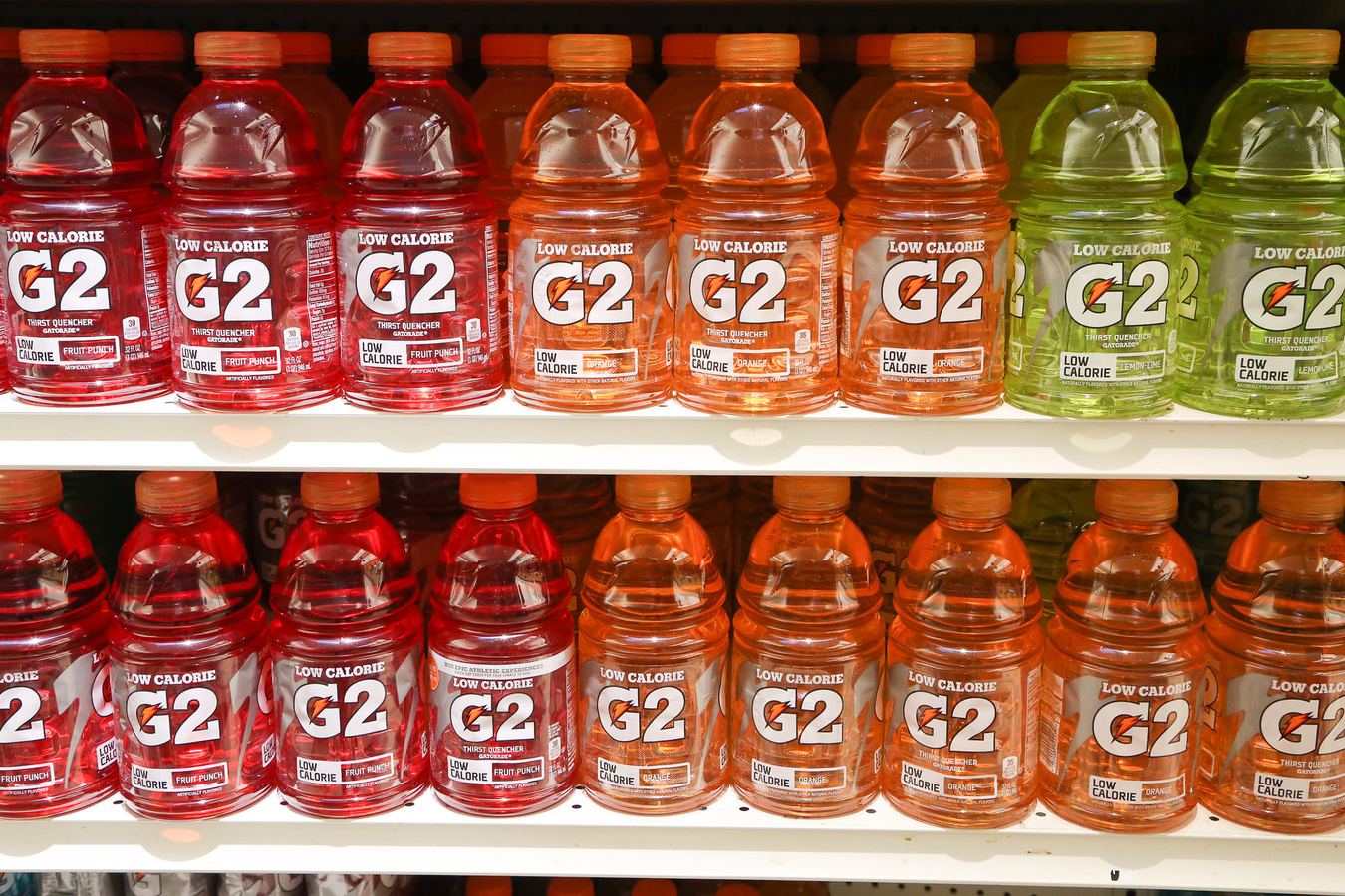 Bottles of Gatorade "G2" sports drink on a store shelf.