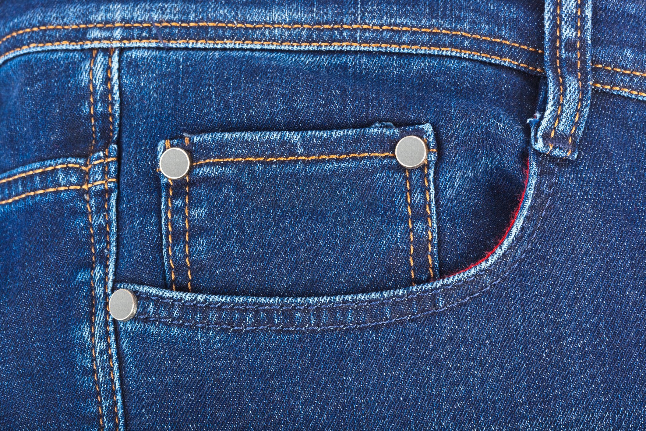 Close-up of a pocket on a pair of blue jeans.
