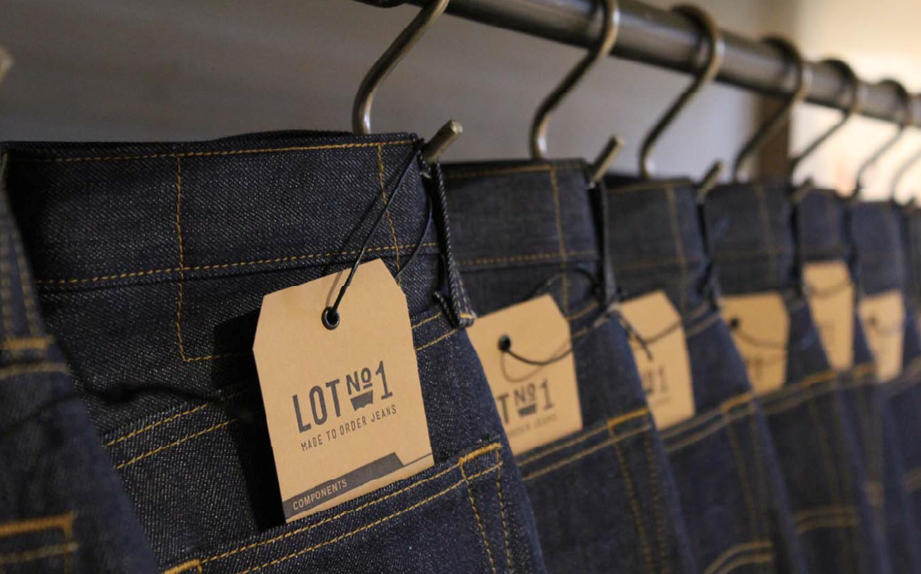 Jeans hanging on a rack.