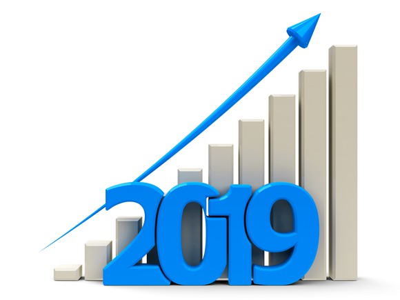 Bar chart with blue line trending up and 2019 in front of the chart.