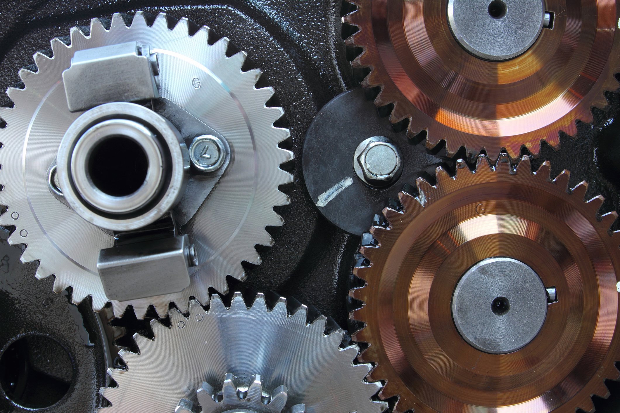 Close-up of steel and copper gears.