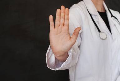 Doctor holding up hand to stop