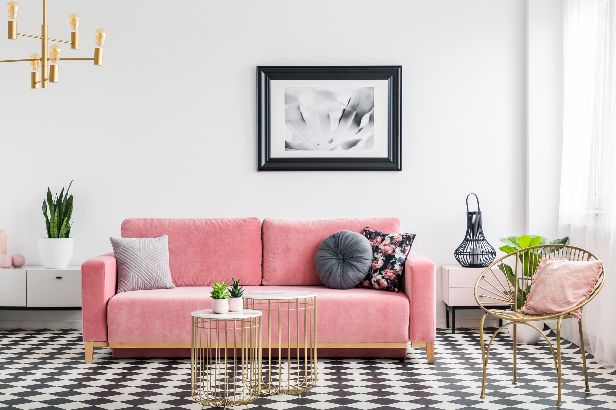 a pink couch in a well-lit living room
