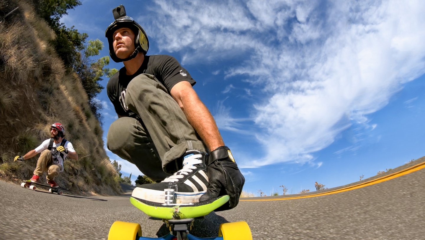 Person skateboarding with a GoPro on his head. 