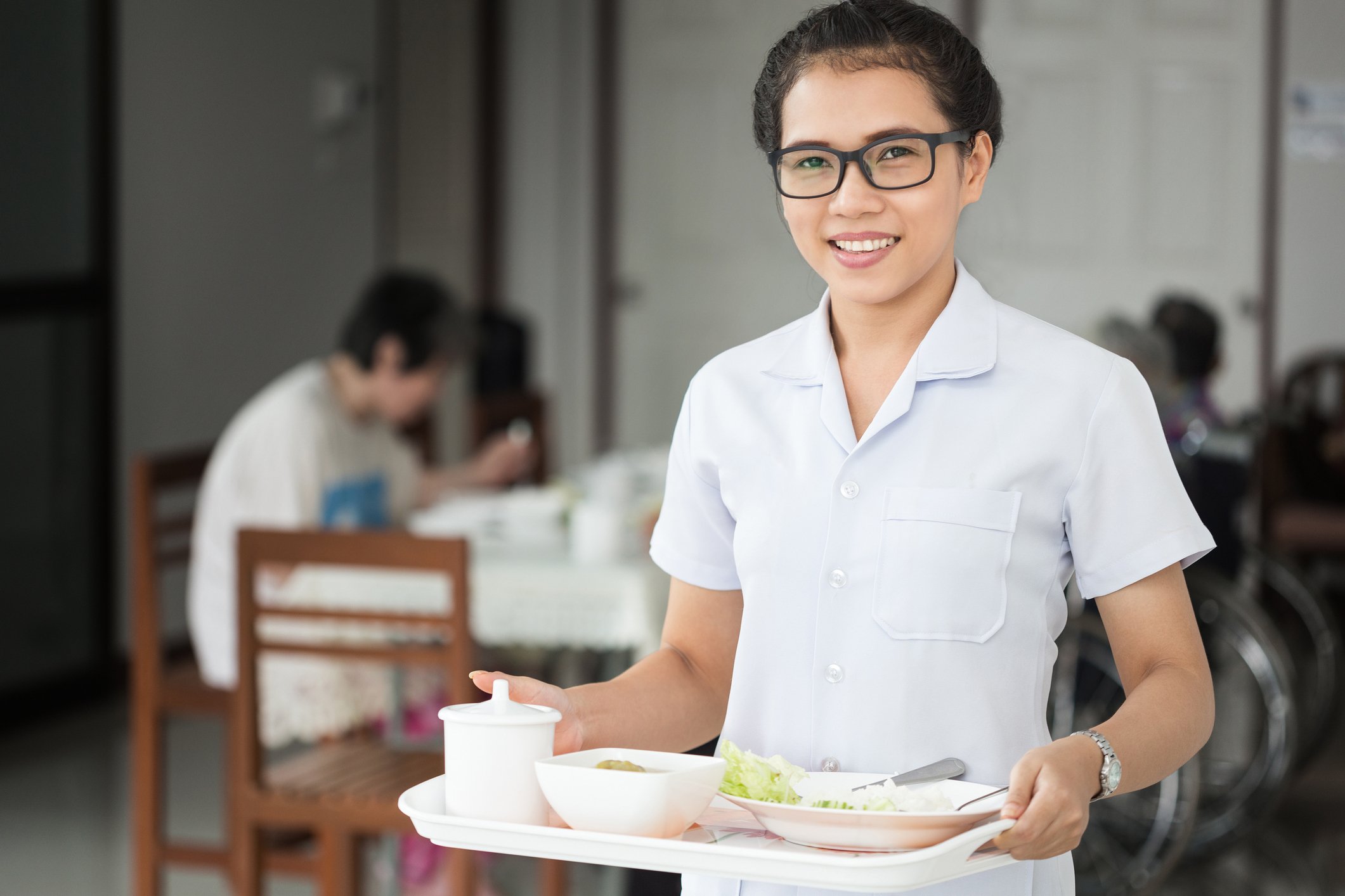 Woman with food tray in hand